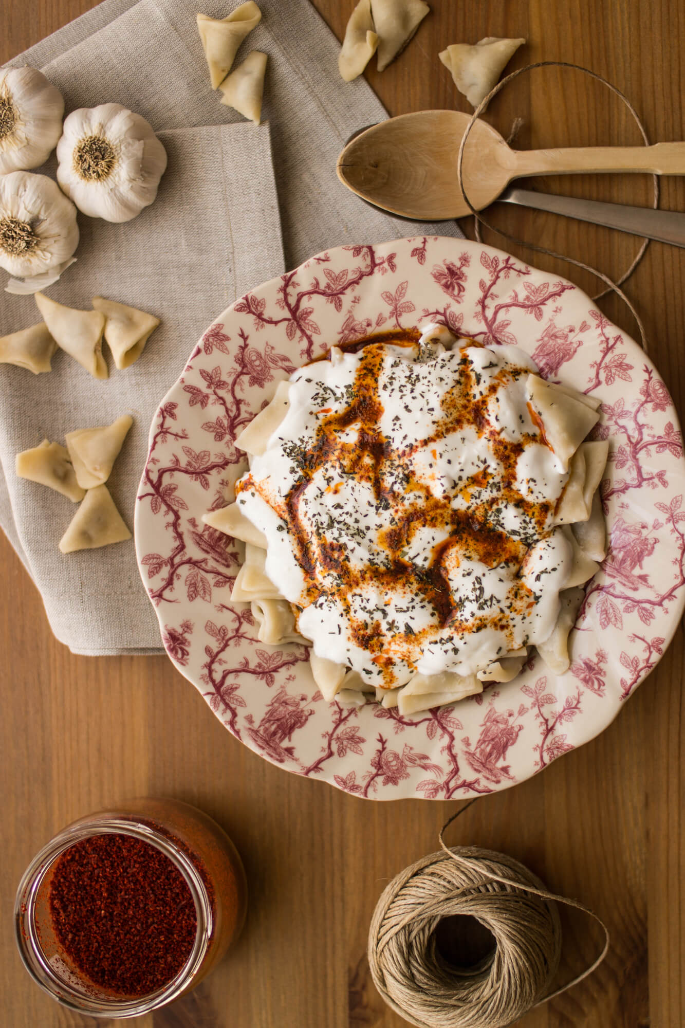 Turkish Manti served with oil and garlic yogurt sauce.