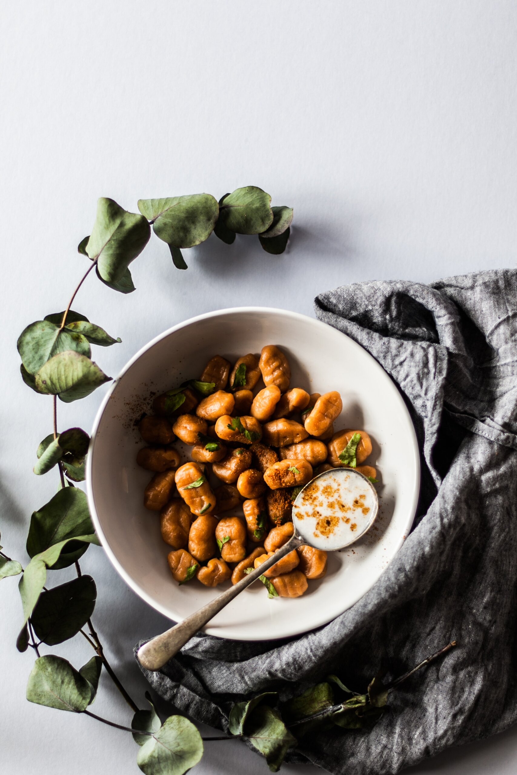 A plate of delicious Italian gnocchi, dough dumplings made of potato.