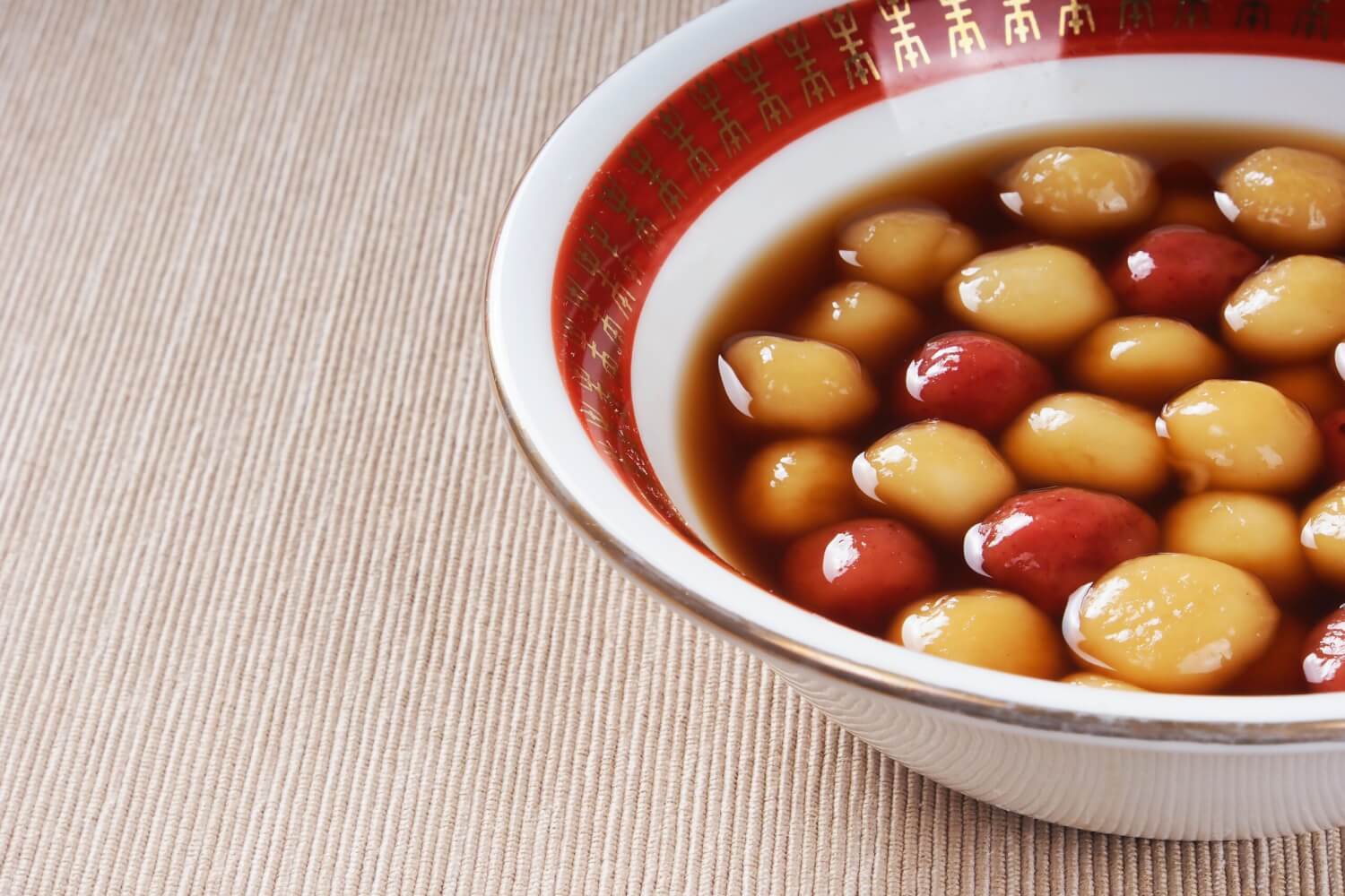 Tangyuan, tasty glutinous Chinese dessert balls that are commonly served in a sweet syrupy broth.